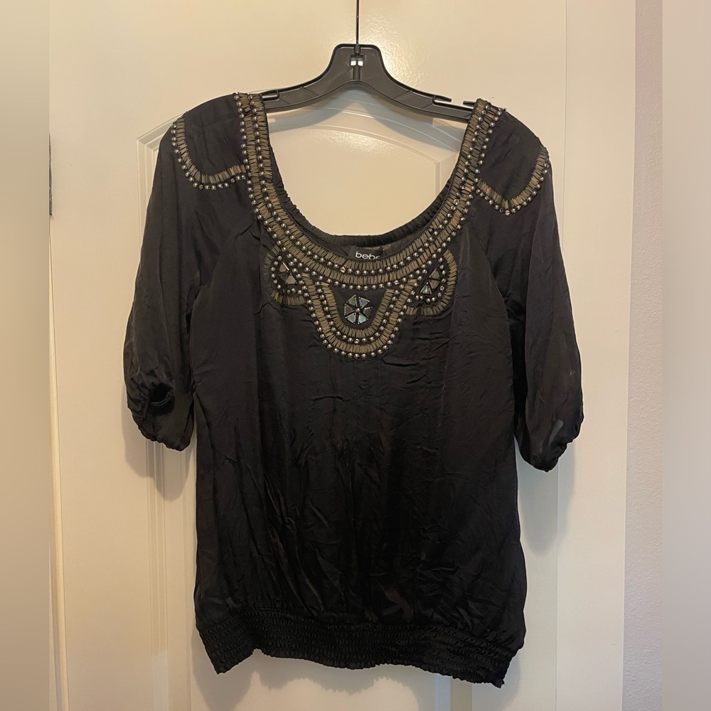bebe black silk top with embellishments in size medium
